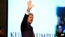 U.S. Secretary of State John Kerry waves as he arrives to speak at the Global Entrepreneurship Summit. 