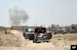 Smoke rises after an airstrike by U.S led coalition warplanes, as Iraq's elite counterterrorism forces enter Shuhada neighborhood in Fallujah, Iraq, June 5, 2016.