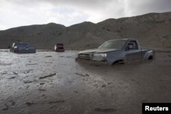 FILE - A mudslide Thursday left nearly 200 vehicles, including 75 semitrailer trucks, stuck in up to five feet of mud and debris on State Route 58 near Tehachapi, California, local police said, Oct. 17, 2015.