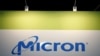 FILE - The logo of U.S. memory chip maker Micron Technology is pictured at its booth at an industrial fair in Frankfurt, Germany, July 14, 2015. 