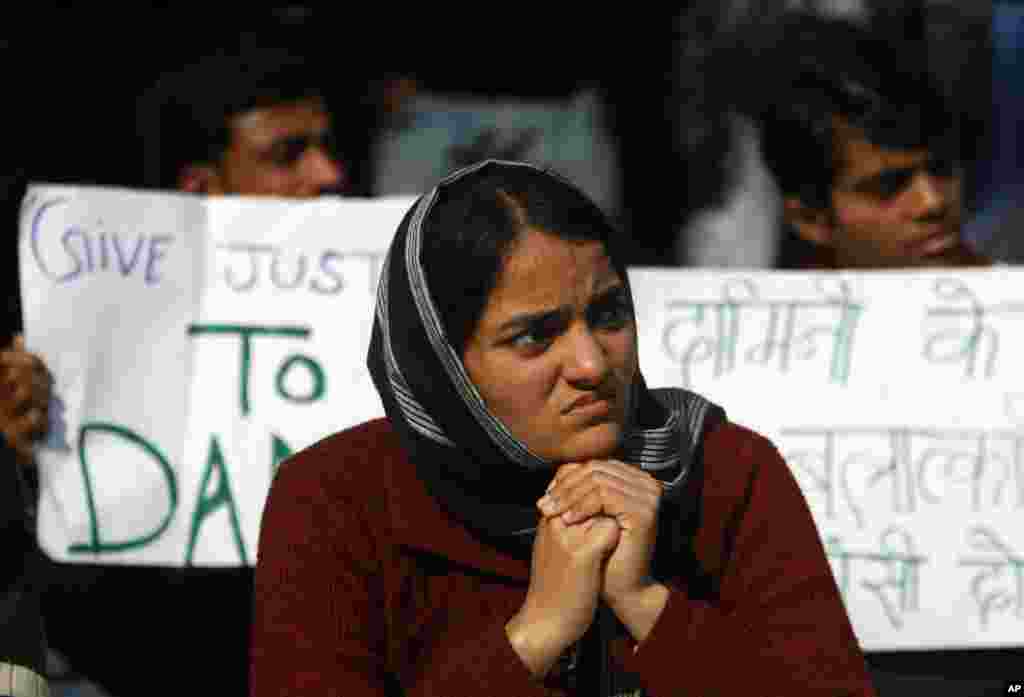 An India woman participates in a protest against the recent gang rape of a young woman in moving bus, in New Delhi, India, January 7, 2013. 
