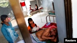 FILE - A malaria patient rests in the only hospital in Pailin, western Cambodia.