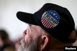 A man looks on as he waits for Republican U.S. presidential candidate Donald Trump to speak at a campaign rally on Super Tuesday in Columbus, Ohio, March 1, 2016.