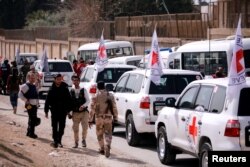 International Committee of the Red Cross (ICRC) convoy seen crossing into eastern Ghouta near Wafideen camp in Damascus, March 5, 2018.