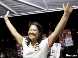 Peruvian presidential candidate Keiko Fujimori of the Fuerza Popular (Popular Force) party greets the media during a campaign rally in Villa Maria del Triunfo, on the outskirts of Lima, Feb. 29, 2016.