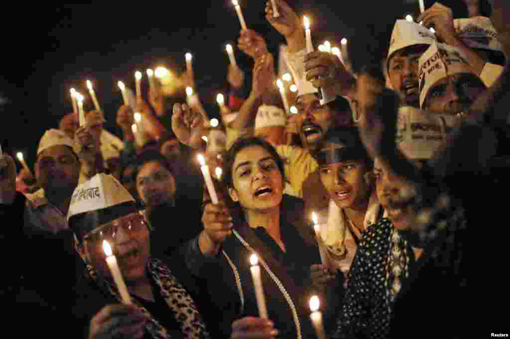 Supporters of Aam Aadmi, or Common Man, Party (AAP) participate in a candle light vigil during a protest against the rape of a female passenger, in New Delhi, Dec. 8, 2014.