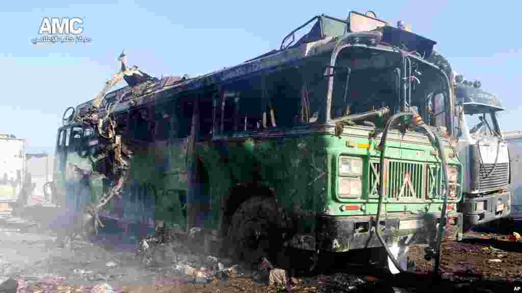 This citizen journalism image shows damages of a burned bus after a Syrian air strike in Aleppo, Dec. 22, 2013.