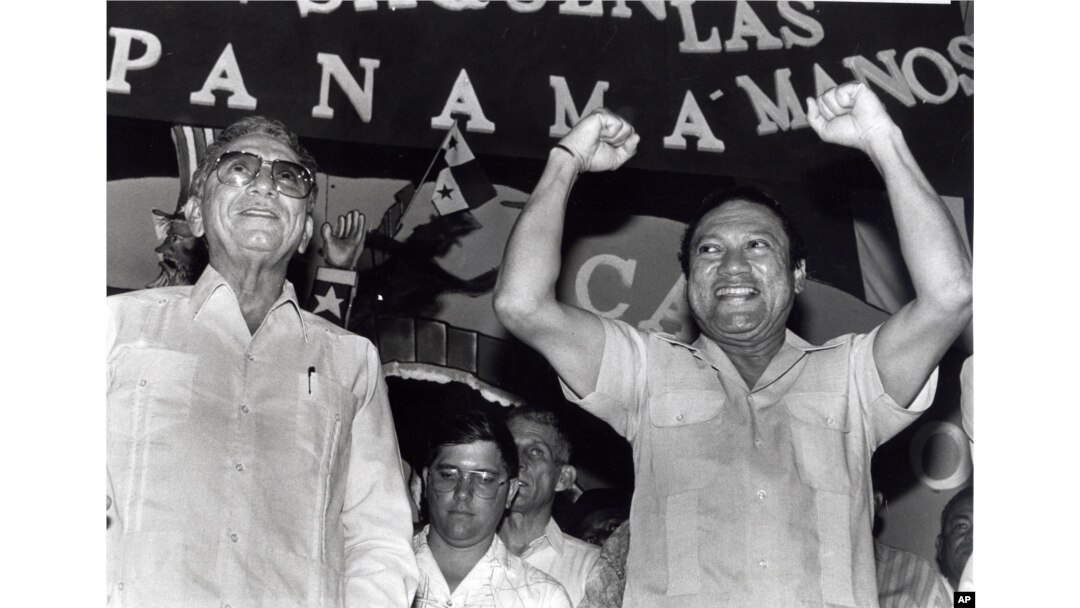 Panama's newly appointed President Manuel Solis Palma stands next to his friend General Manuel Antonio Noriega who appointed him during a rally in 1988.