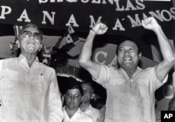Panama's newly appointed President Manuel Solis Palma stands next to his friend General Manuel Antonio Noriega who appointed him during a rally in 1988.