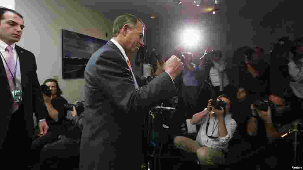 Speaker of the House John Boehner emerges from a meeting with Republican House members in the U.S. Capitol, October 16, 2013.