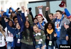 Students celebrate at the end of the March for Our Lives event in Washington, D.C., March 24, 2018.