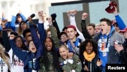 Students celebrate at the end of the March for Our Lives event in Washington, D.C., March 24, 2018.