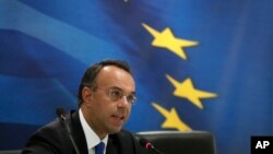 Deputy Finance Minister Christos Staikouras speaks during press conference in Athens, Oct. 7, 2013.