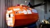 Jean-Jacques Savin, a former paratrooper, 71, works on the construction of a ship made from a barrel at the shipyard in Ares, southwestern France, Nov. 15, 2018. He is several days into his attempt to cross the Atlantic in a specially-built orange barrel, Dec. 31, 2018.