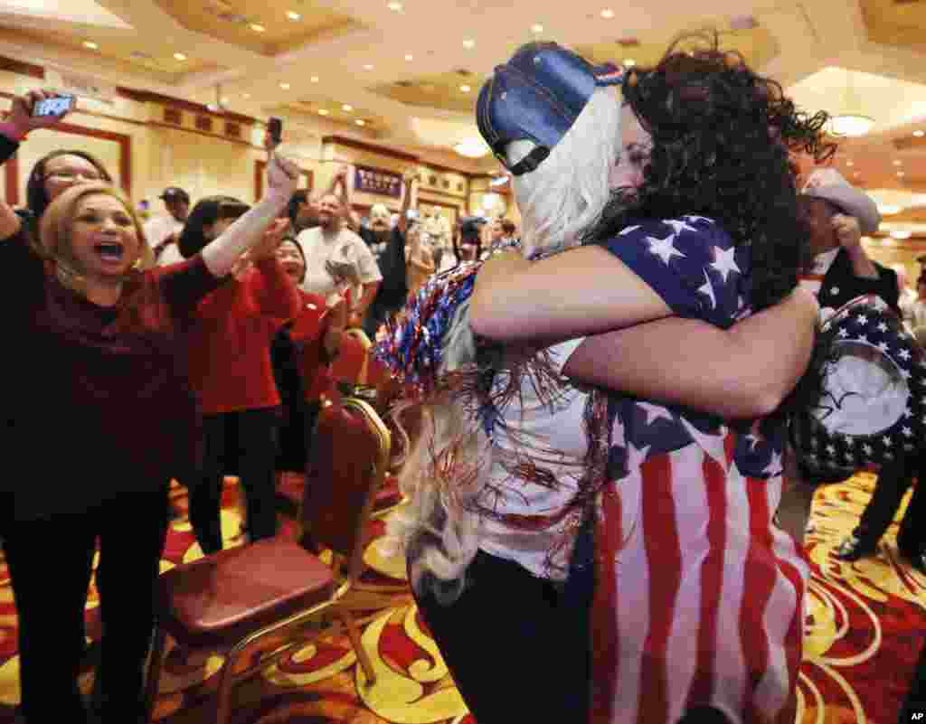 Diana Caldon, right, embraces Stephanie Smith in celebration at an election night watch party hosted by the Nevada GOP as Donald Trump wins the presidency, Nov. 8, 2016, in Las Vegas. 
