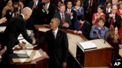 President Barack Obama shakes hands with Vice President Joe Biden after giving his State of the Union address before a joint session of Congress on Capitol Hill in Washington, Jan. 12, 2016.