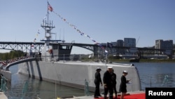 The autonomous ship Sea Hunter, developed by the Pentagon's Defense Advanced Research Projects Agency, is shown docked after its christening ceremony in Portland, Oregon, April 7, 2016.