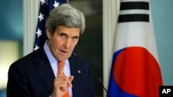 Secretary of State John Kerry gestures while speaking after a meeting with South Korean Foreign Minister Yun Byung-se at the State Department in Washington, Tuesday, Jan. 7, 2014. 