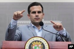 FILE - Puerto Rico Gov. Ricardo Rossello speaks during a press conference regarding the number of estimated deaths in the aftermath of Hurricane Maria, in San Juan, Puerto Rico, Aug. 28, 2018.