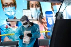 Virus Outbreak US Surge