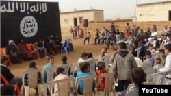 A year-end ceremony for school children at an Islamic State-run school.