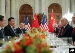 FILE - President Donald Trump and China's President Xi Jinping lead their respective delegations during their bilateral meeting at the G-20 summit, Dec. 1, 2018, in Buenos Aires, Argentina.