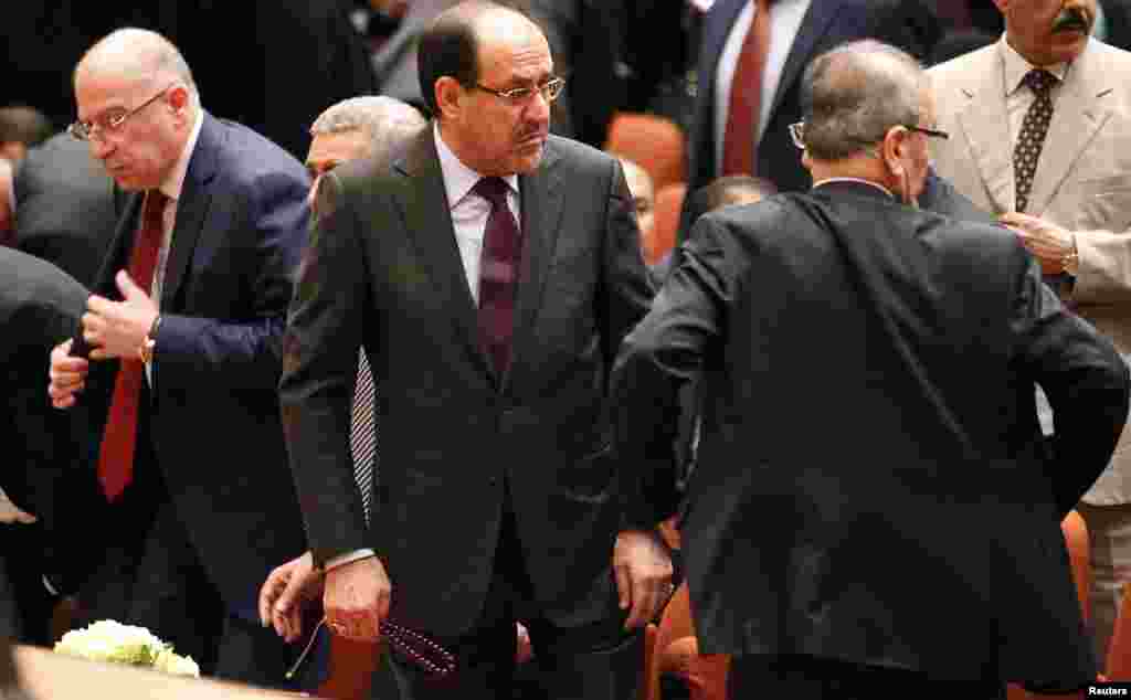 Iraqi Prime Minister Nuri al-Maliki (center) attends a session at the parliament headquarters in Baghdad, July 1, 2014.
