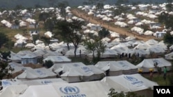 FILE - Tents stretch out in all directions at the Mahama refugee camp in Rwanda.