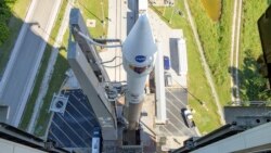 In this image released by NASA, a United Launch Alliance Atlas V rocket with the Lucy spacecraft aboard is rolled out of the Vertical Integration Facility to the launch pad at Space Launch Complex 41, Thursday, Oct. 14, 2021, in Cape Canaveral, Fla. (Bill Ingalls/NASA)