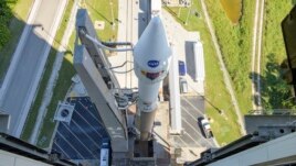 In this image released by NASA, a United Launch Alliance Atlas V rocket with the Lucy spacecraft aboard is rolled out of the Vertical Integration Facility to the launch pad at Space Launch Complex 41, Thursday, Oct. 14, 2021, in Cape Canaveral, Fla. (Bill Ingalls/NASA)