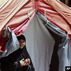 A Syrian refugee looks out from a medical tent at a refugee camp in the Turkish border town of Yayladagi in Hatay province July 1, 2011