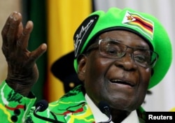 FILE - Former Zimbabwean President Robert Mugabe addresses a meeting of his party's youth league in Harare, Zimbabwe, Oct. 7, 2017.