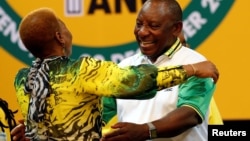 Deputy president of South Africa Cyril Ramaphosa greets an ANC member during the 54th National Conference of the ruling African National Congress (ANC) at the Nasrec Expo Center in Johannesburg, South Africa, Dec. 18, 2017.