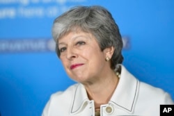 FILE - Britain's Prime Minster Theresa May speaks at a EU election campaign event in Bristol, England, May 17, 2019.