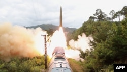 This Sept. 15, 2021, photo released from North Korea's official Korean Central News Agency (KCNA) shows a test firing drill of a railway-borne missile regiment. (Photo by STR / KCNA VIA KNS / AFP) 