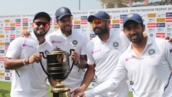 From left, India's Rishabh Pant, Umesh Yadav, Mohammed Shami and Wriddhiman Saha pose with the winners trophy after their win on the fourth day of third and last cricket test match between India and South Africa in Ranchi, India, Tuesday, Oct. 22, 2019. I