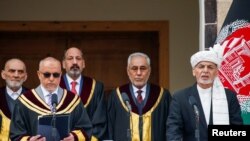 Afghanistan's President Ashraf Ghani takes an oath during his inauguration as president, in Kabul, Afghanistan March 9, 2020. 