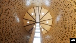 FILE - First names of Holocaust victims are written in Hebrew, Yiddish and English in this exhibit called the "Room of Remembrance" at the Illinois Holocaust Museum & Education Center in Skokie, Illinois. 