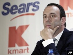 FILE - Kmart chairman Edward Lampert listens during a news conference to announce the merger of Kmart and Sears in New York, Nov. 17, 2004.