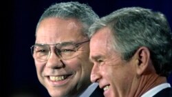 FILE - In this Dec. 16. 2000 file photo, President-elect Bush smiles as he introduces retired Gen. Colin Powell as his nominee to be secretary of state during a ceremony in Crawford, Texas.