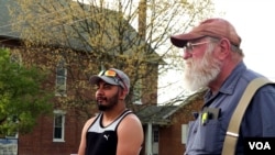 Two York Springs residents wait their turn to order from a taco truck that does business in the town. (M. Kornely/VOA)