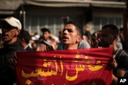 A demonstrator chants slogans during a protest in Casablanca, Morocco, Oct. 8, 2017.