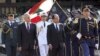 Lebanese President Michel Suleiman, second left, and French President Francois Hollande, second right, review honor guards, at the Presidential Palace in Baabda, east of Beirut, Lebanon, November 4, 2012.