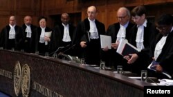 FILE - Judges are seen at the International Court of Justice, the U.N.'s highest court for disputes between states, in The Hague, the Netherlands.