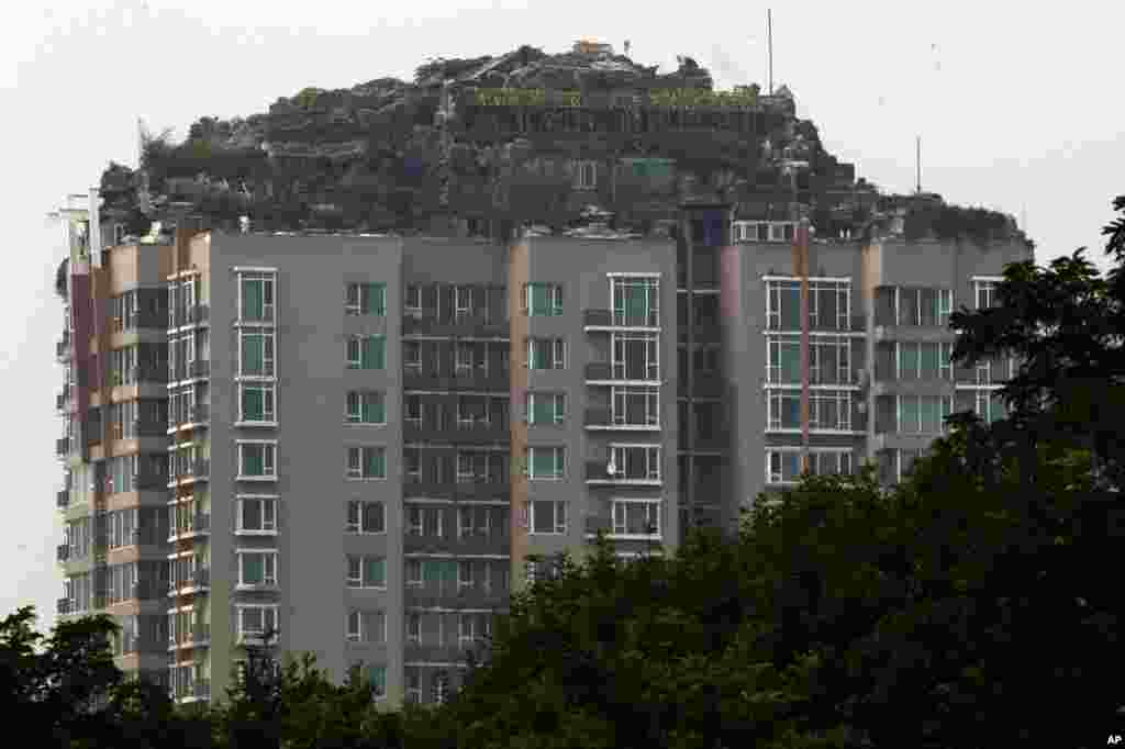 A rooftop villa complete with rocks and flora is built on top of a high rise residential building in Beijing, China. Beijing authorities are planning to demolish the rooftop villa that allegedly was built illegally atop a 26-story apartment block in the capital.