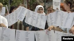 FILE - Bosnian Muslim women from Visegrad hold a peaceful protest of the U.N. war crimes tribunal's failure to include counts of rape in indictments against Bosnian Serb cousins Milan and Sredoje Lukic, Sarajevo, July 18, 2008.