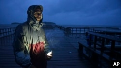 David Cruz Marrero watches the waves at Punta Santiago pier hours before the imminent impact of Maria, a Category 5 hurricane that threatens to hit the eastern region of the island with sustained winds of 165 miles per hour, in Humacao, Puerto Rico, Sept.