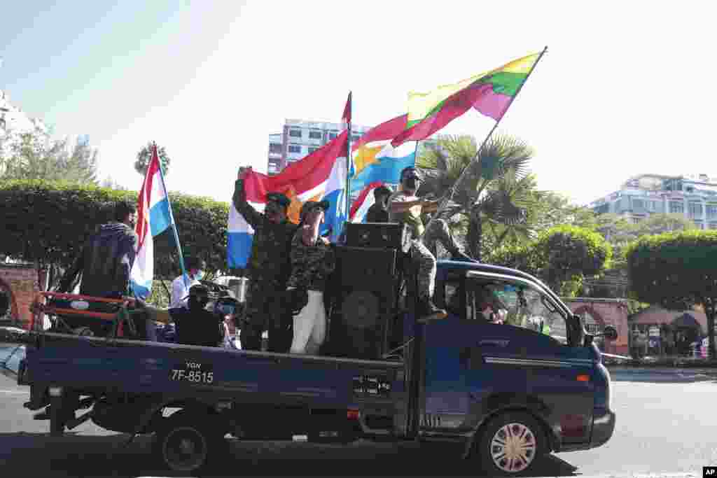 Supporters of the military wave national and military flags in Yangon, Myanmar. The military staged a coup and detained senior politicians including Nobel laureate and de facto leader Aung San Suu Kyi.