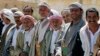 FILE - Pro-government tribesmen attend a tribal gathering to denounce the deployment of militants of the Shi'ite Houthi group, near Amran city, the capital of Amran province north of the Yemeni capital Sanaa, April 13, 2014.