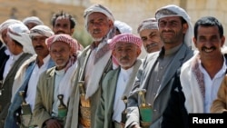 FILE - Pro-government tribesmen attend a tribal gathering to denounce the deployment of militants of the Shi'ite Houthi group, near Amran city, the capital of Amran province north of the Yemeni capital Sanaa, April 13, 2014.